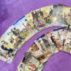 Talia tarota OIRAN Tarot Cards Double Major rozłożone karty na fioletowym tle